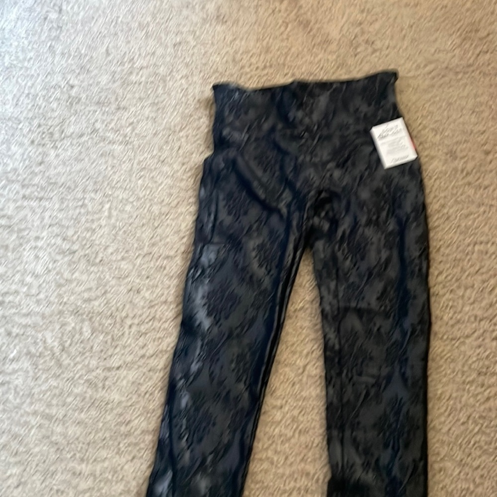 Never worn Spanx black floral print small